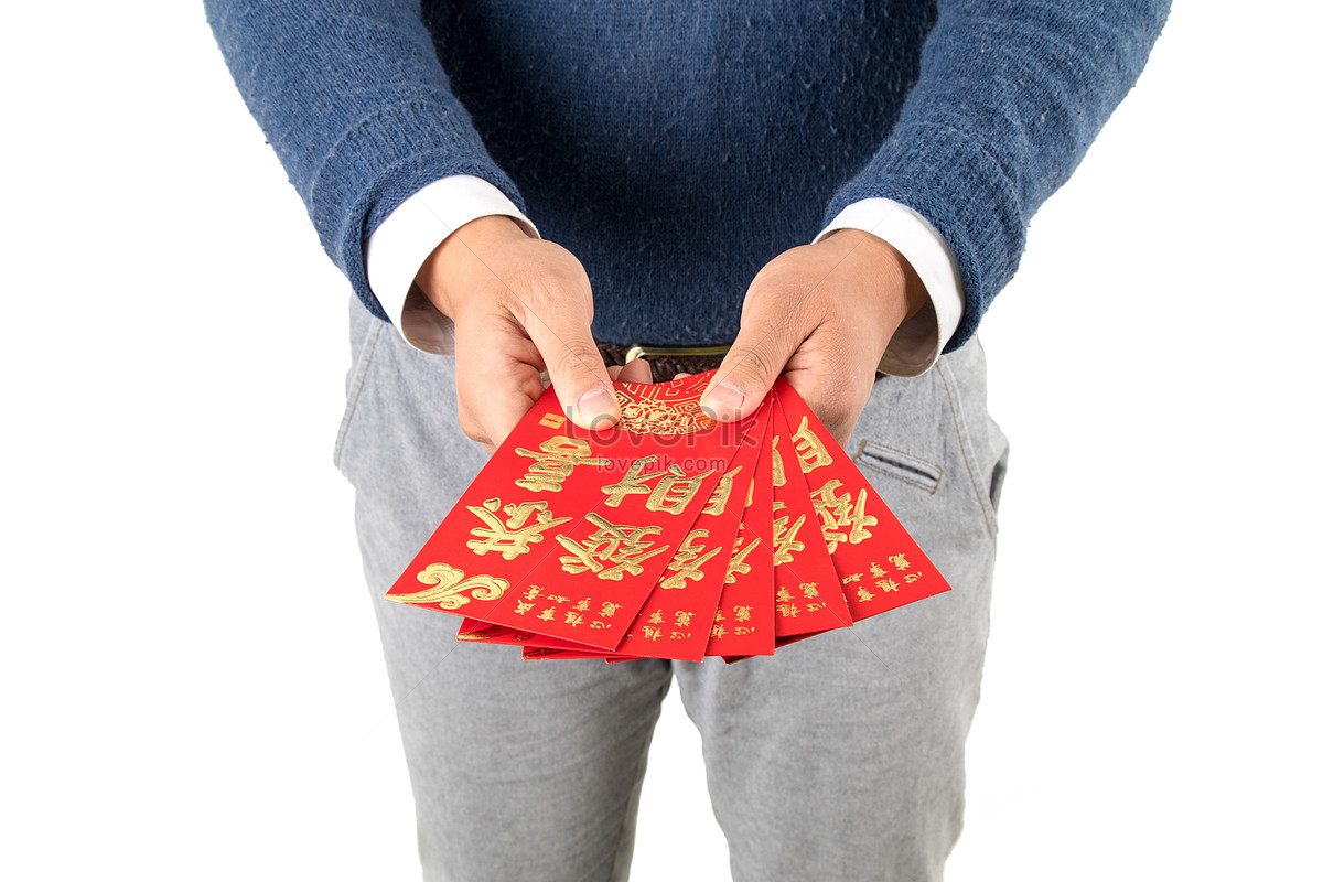 hand giving money in red envelope over white, Stock image