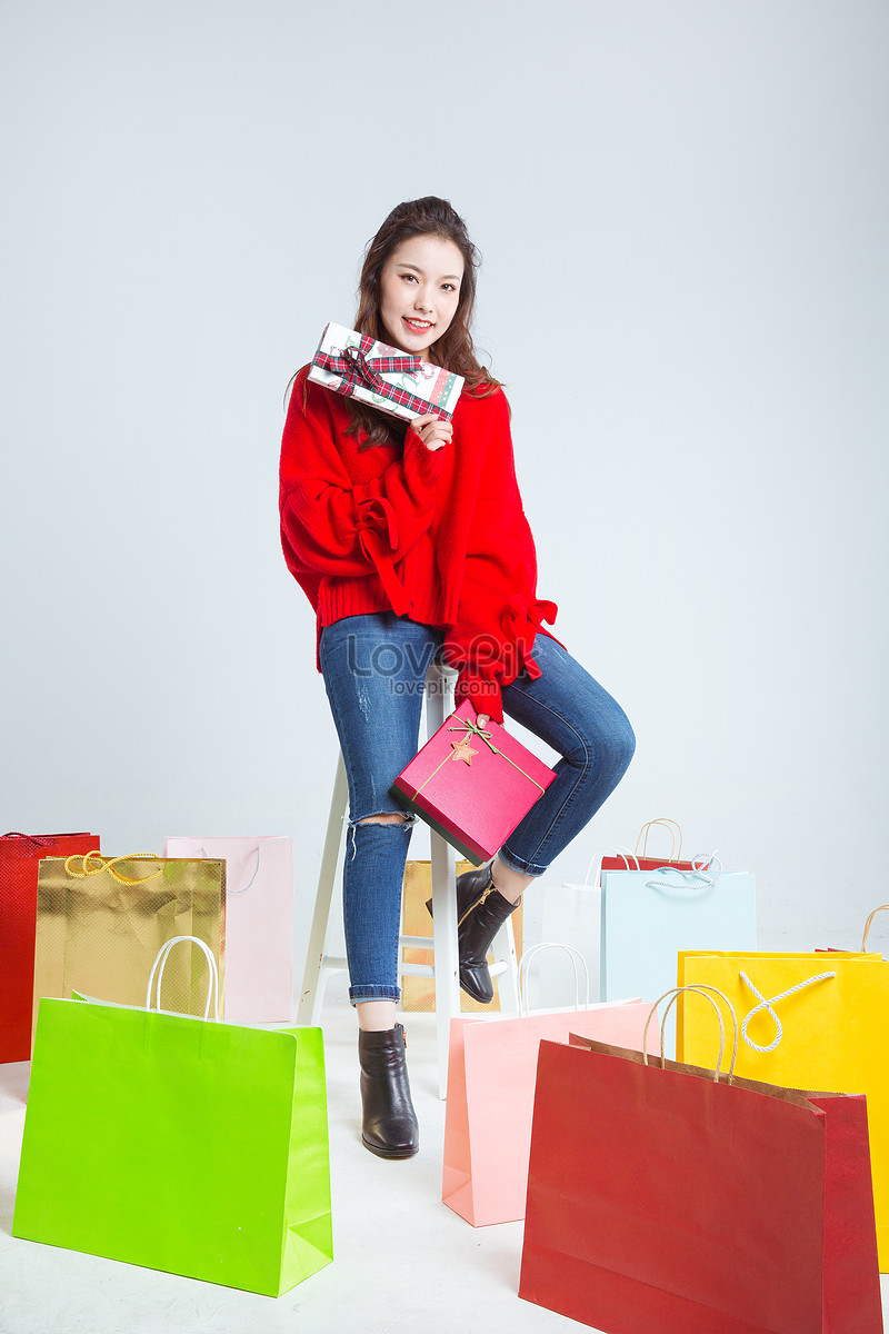 Shopaholic woman with lots of bags Stock Photo | Adobe Stock