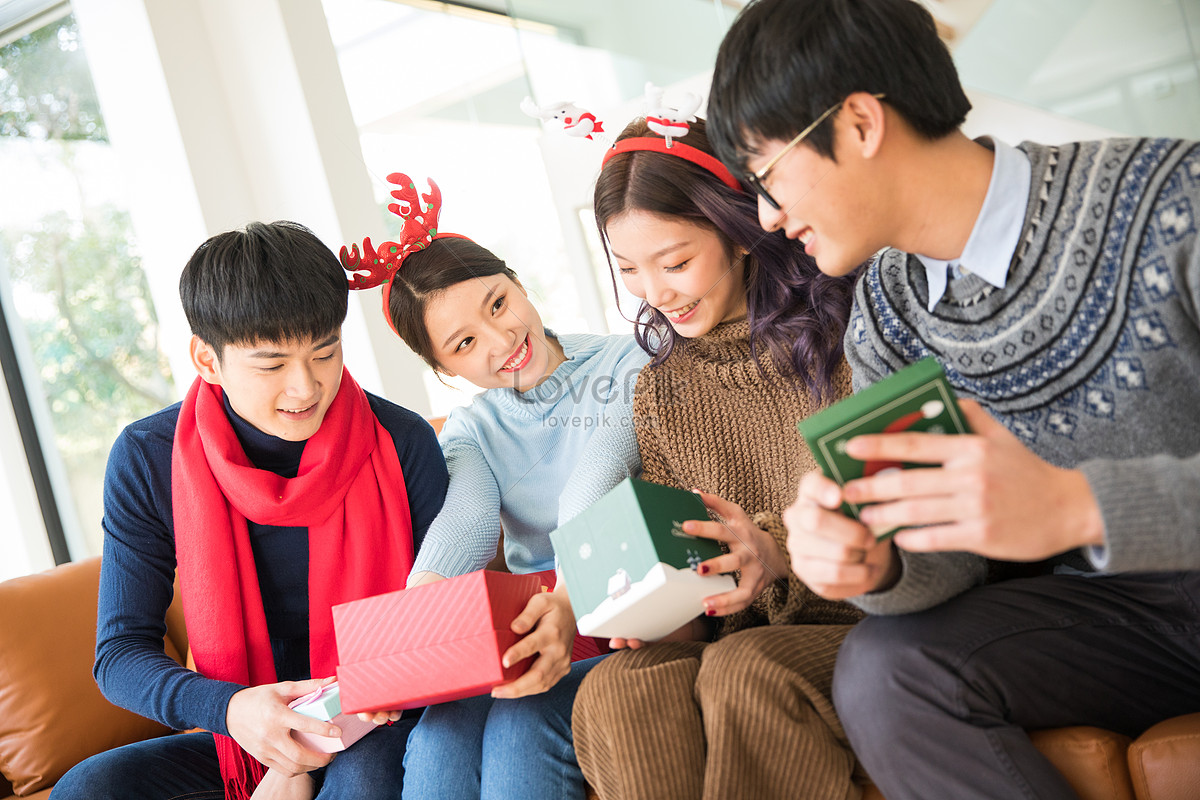 Christmas Friends Gather To Give Gifts To Each Other Picture And HD ...