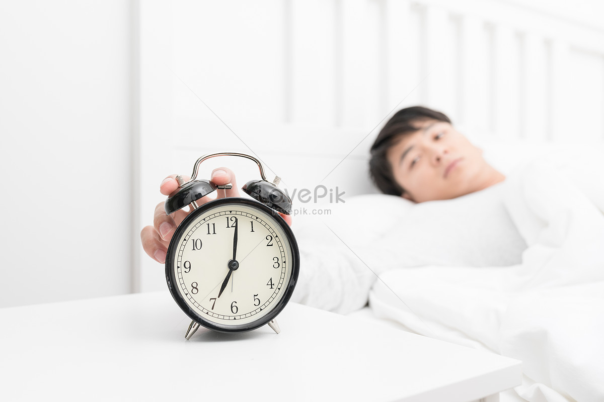 Young People Awakened By The Alarm Clock In The Morning Picture And HD ...