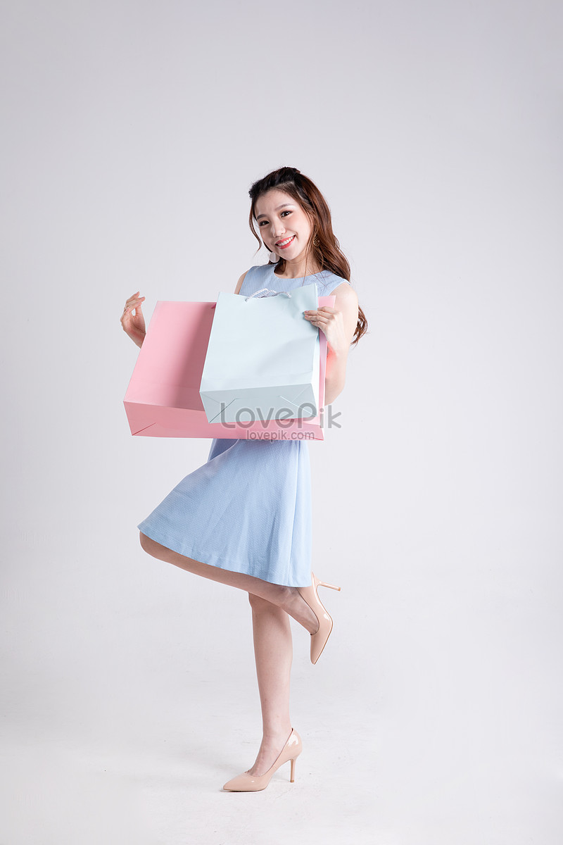 Young Women Happily Carrying Shopping Bags Picture And HD Photos | Free ...