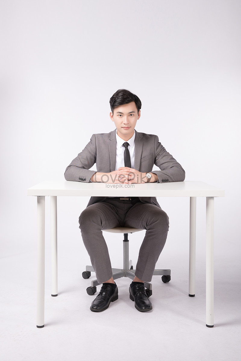 A Business Man Sitting At The Table Picture And HD Photos | Free ...