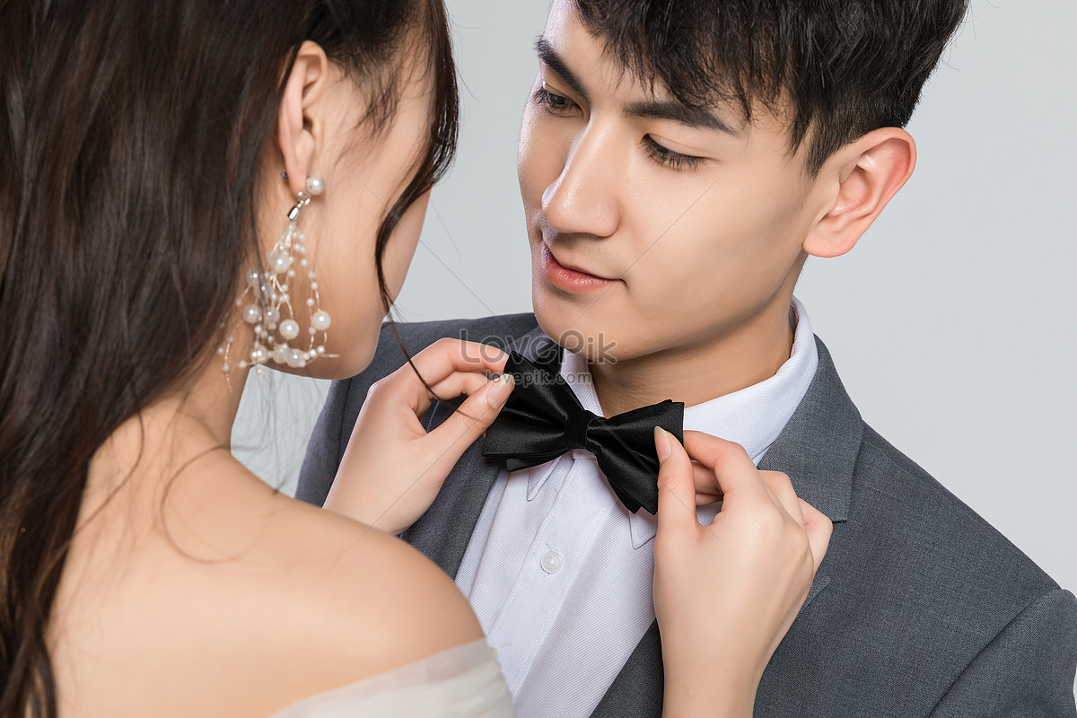 A Young Wife Ties A Tie For Her Husband Picture And HD Photos | Free  Download On Lovepik