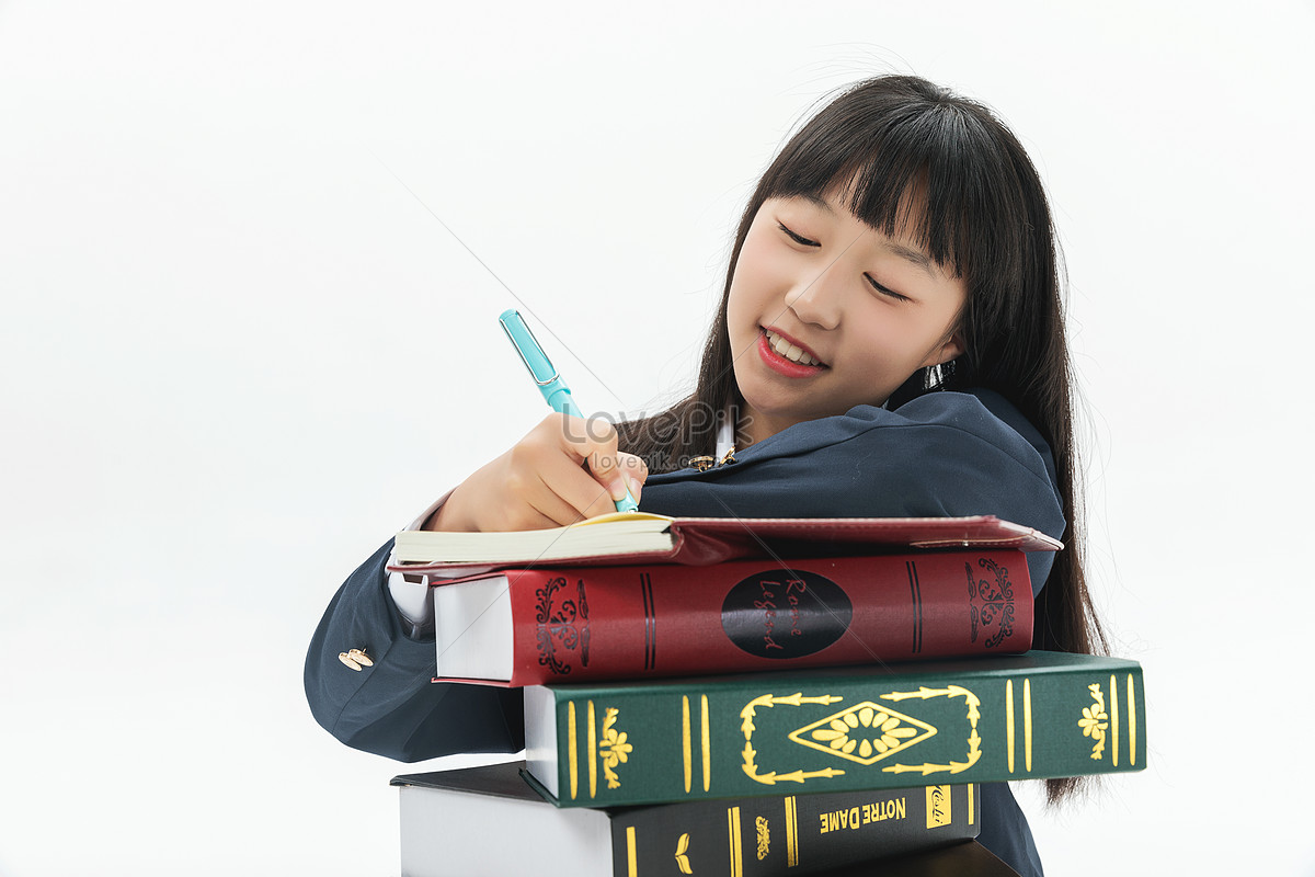 Female students write their homework by books, and homework, book, woman student HD Photo