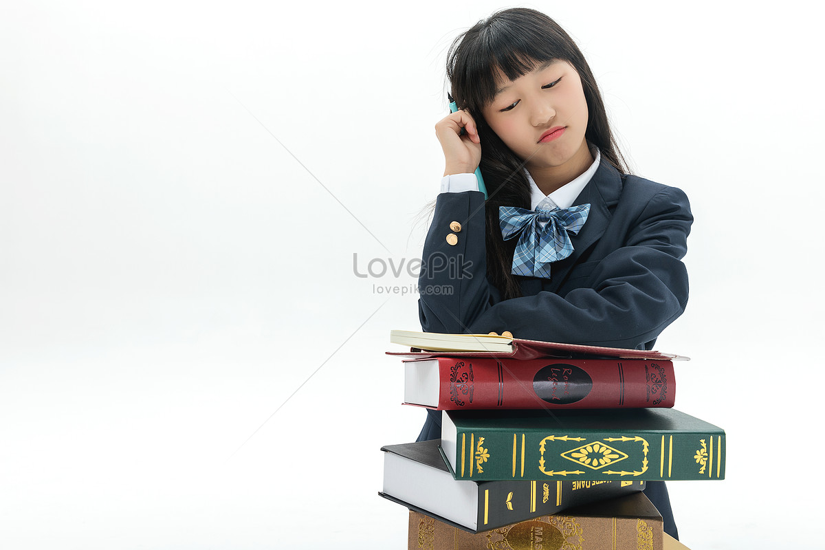 Female students write their homework by books, and homework, book, chinese woman HD Photo
