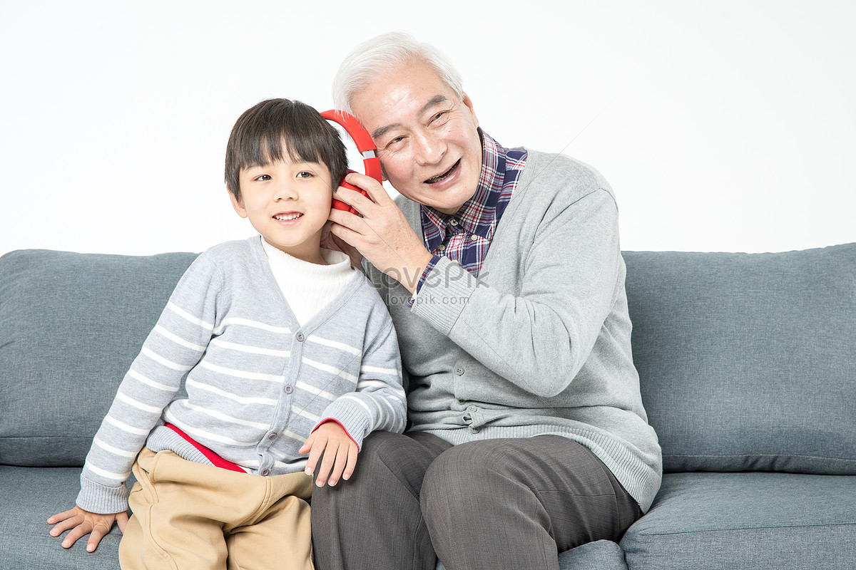 Grandfather And Grandson Listen To Songs On The Sofa Picture And Hd