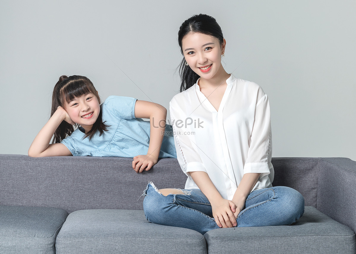 Asian mother and daughter Group photo hair Care poster White background. Asian Middle-aged mother and daughter Group photo Hairdressing poster White background. Close young