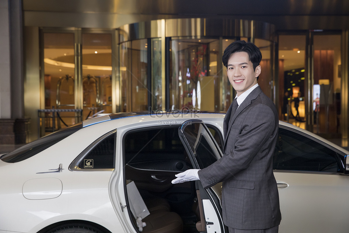 Drive doors. Door attendant in Hotel. Dubai the Hotel attendant is Opening the car Door. Door attendant in Hotel PNG. The Hotel attendant is Opening the car Door.