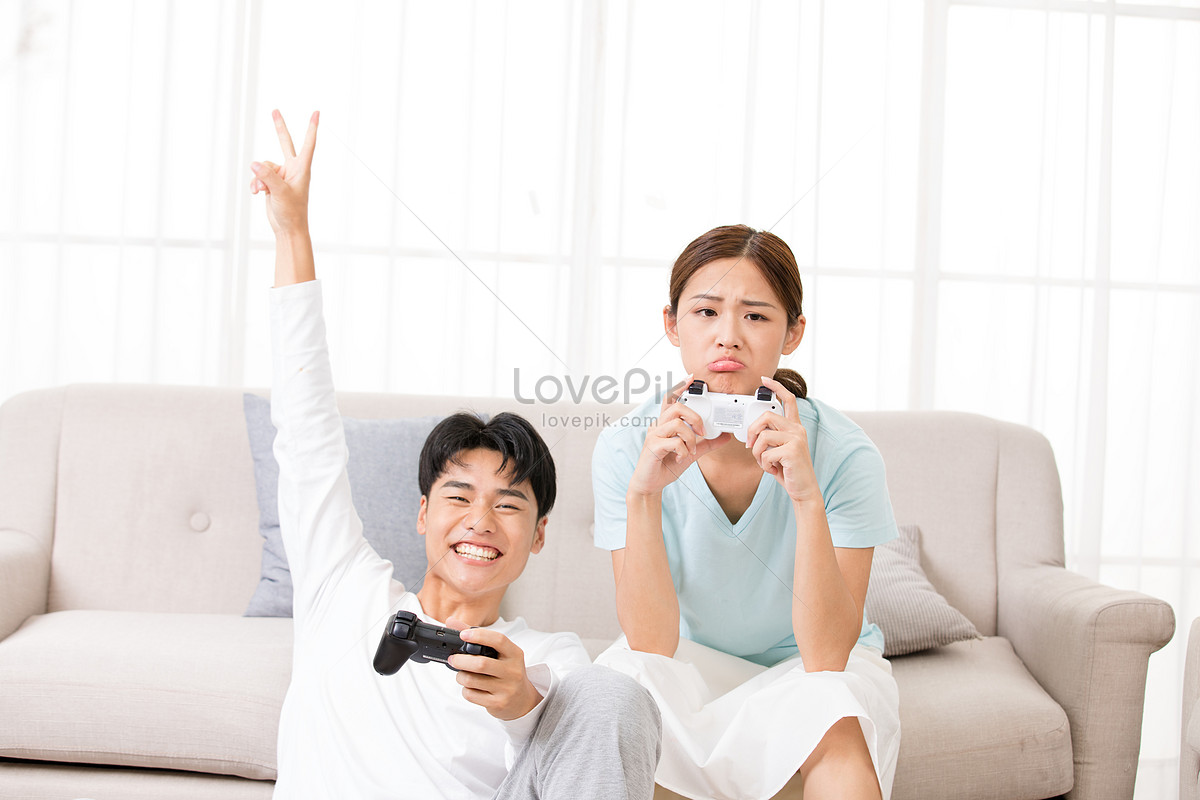 Couple Playing Games Together In The Living Room At Home Picture And HD  Photos | Free Download On Lovepik