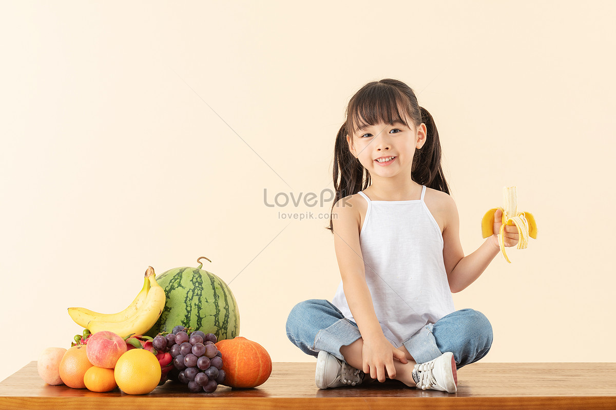  Woman eating banana  - Envato Elements