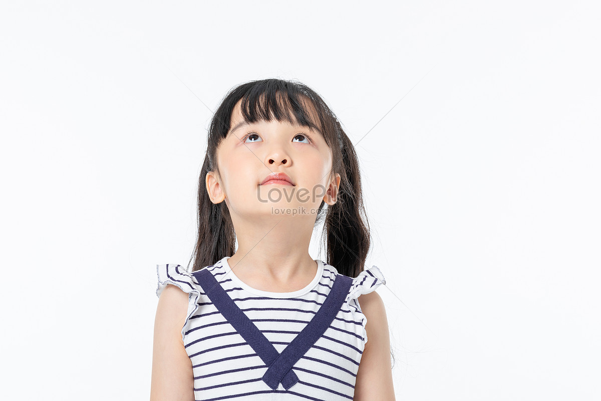 A Cute Little Girl Wearing Radha Dress Standing while Posing at the Camera  · Free Stock Photo