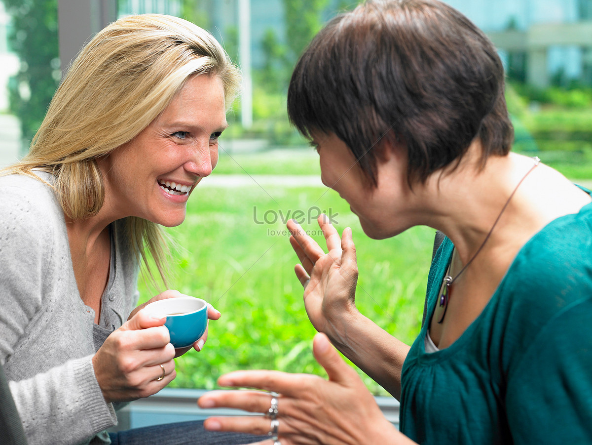 Nice conversation. A gossiping person photo.