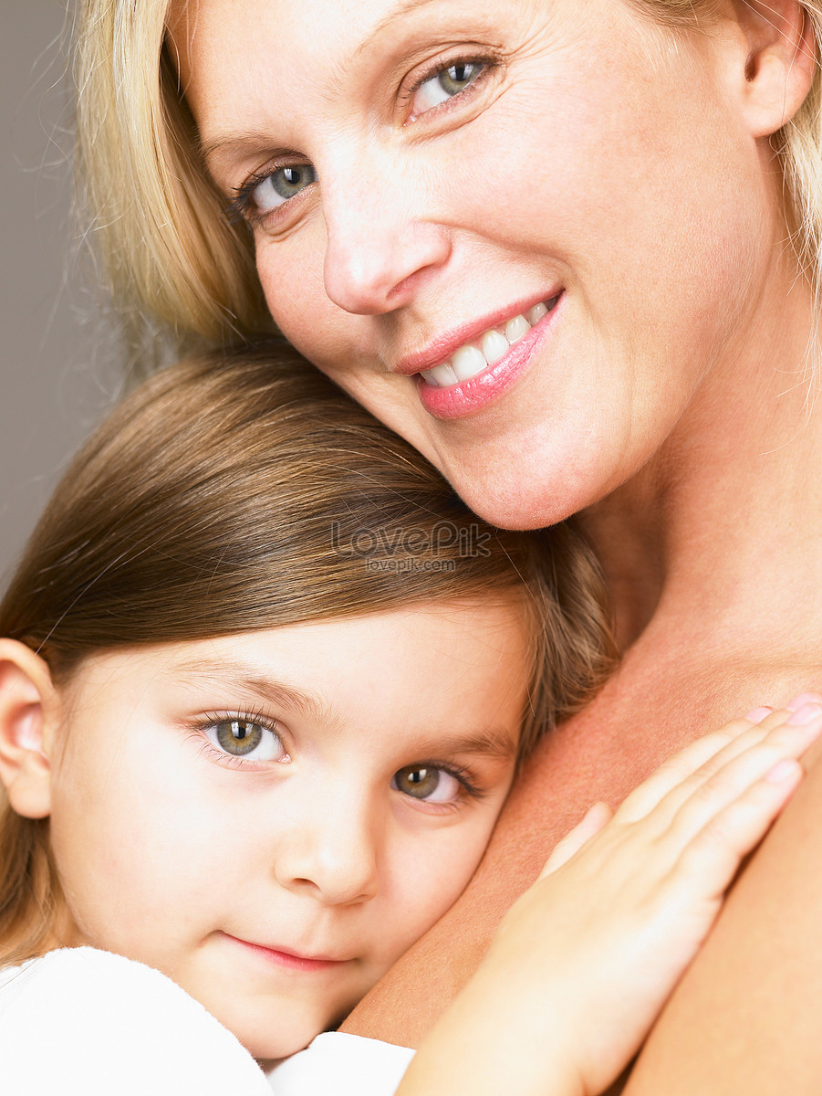 Mom Hugging Her Daughter Looking At Camera Picture And Hd Photos Free 