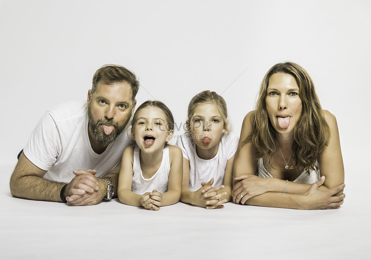 Studio Portrait Of Two Sisters And Parents Making Faces Picture And HD  Photos | Free Download On Lovepik