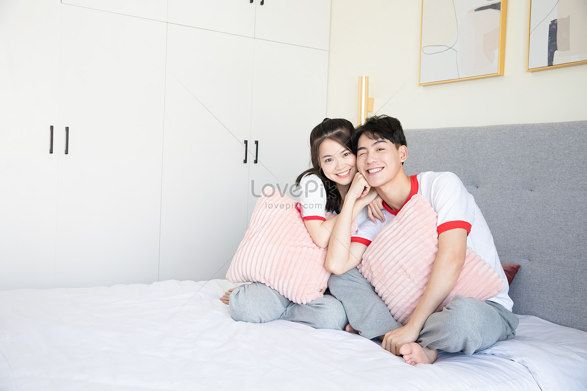 Asian couple bedroom play