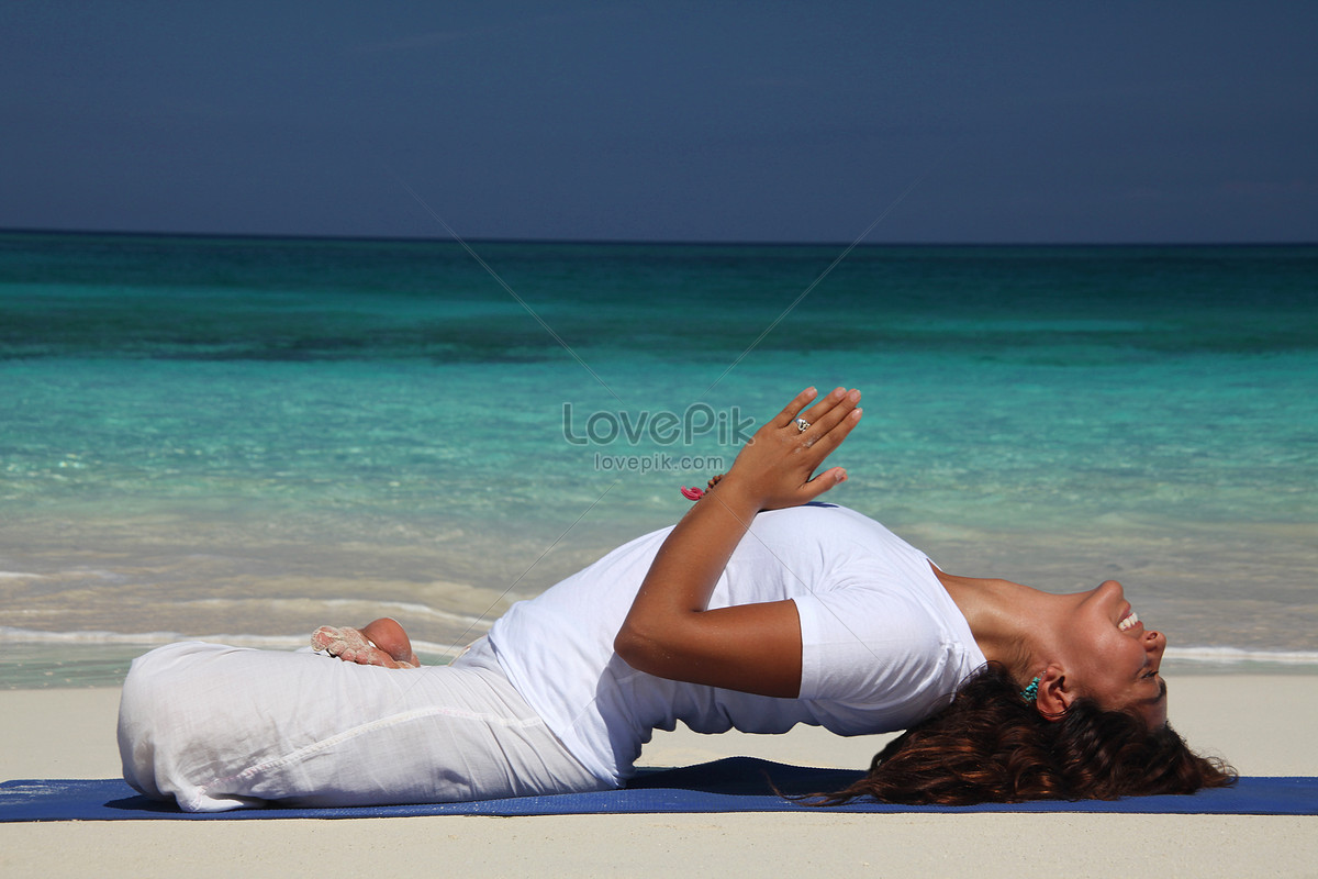 Young Woman Doing Yoga On Paradise Island Beach In Nassau Baham Picture