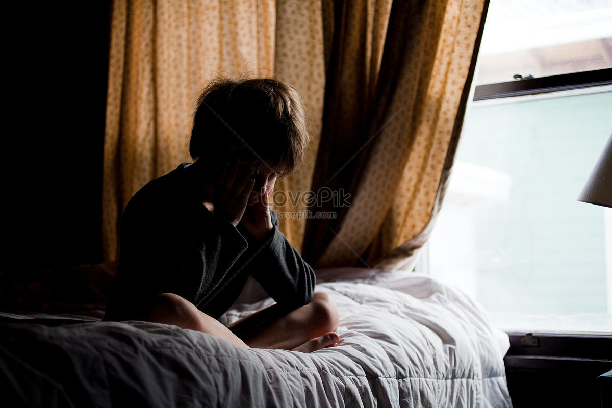Crying Boy Sitting On Bed Picture And HD Photos | Free Download On ...