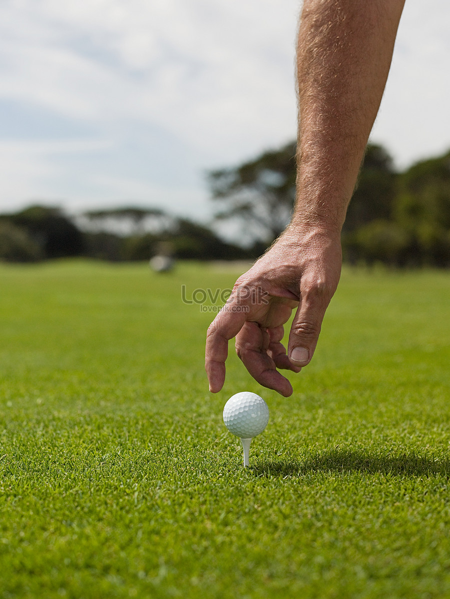 Roll up in a ball. Человек собирает мячи для гольфа. Man playing Golf White background.