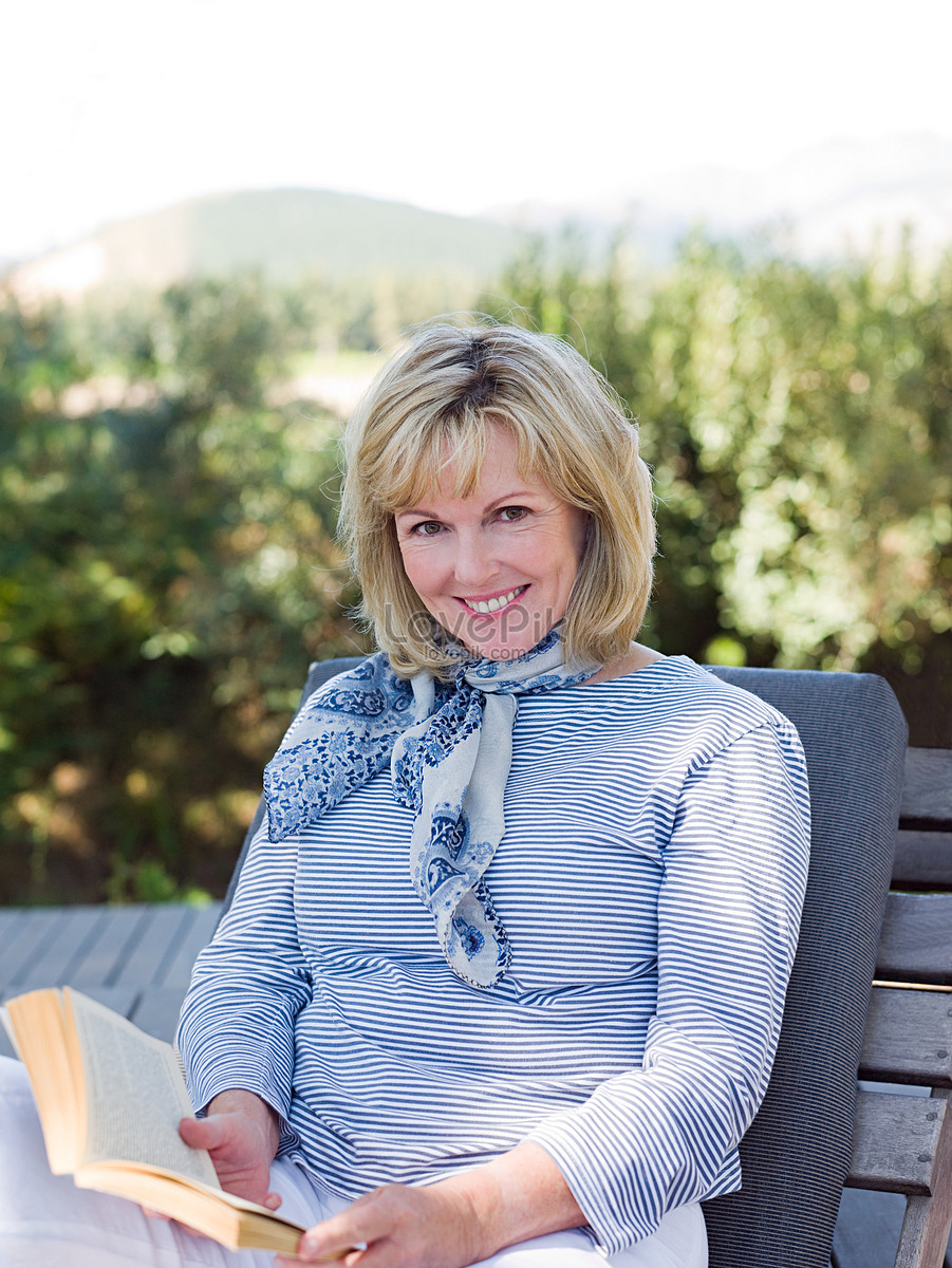 Mature Woman Reading A Book Leisurely In The Sun Picture And HD Photos |  Free Download On Lovepik