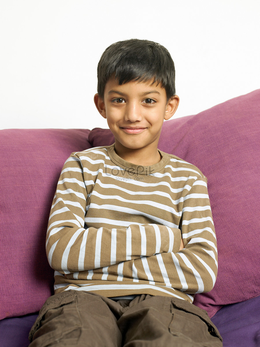 Smiling Boy Sitting On The Sofa Picture And HD Photos | Free Download ...