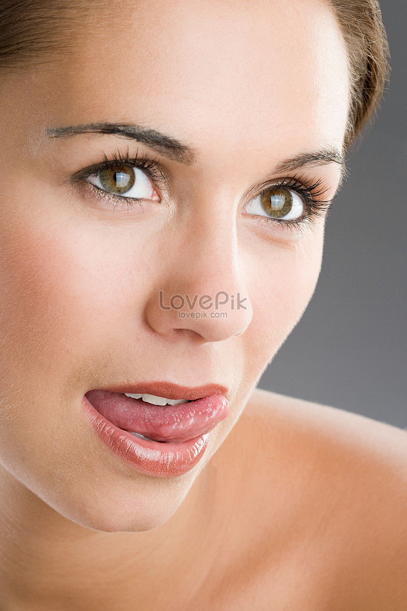 Woman Licking Lips