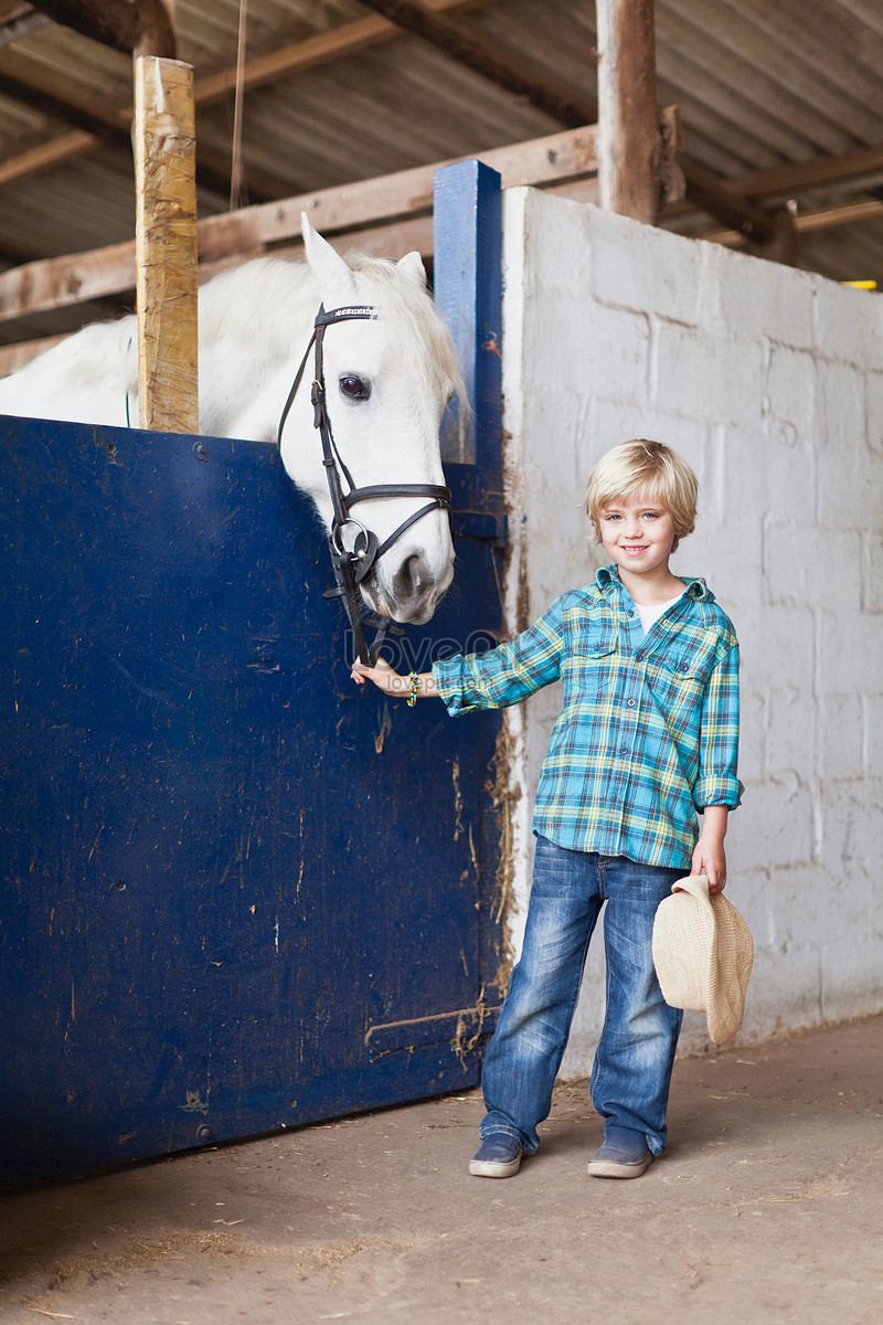 Boy Standing In Stable Picture And HD Photos | Free Download On Lovepik