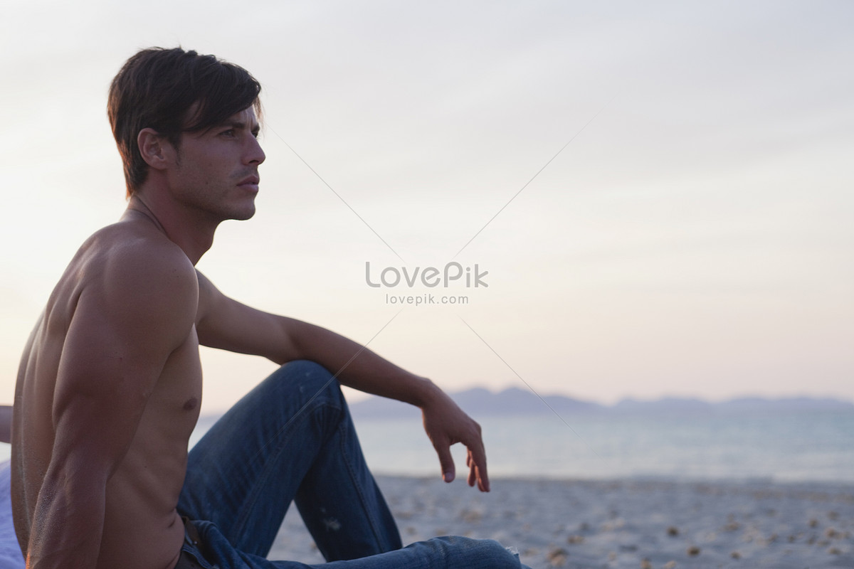 Sensual Male Model Posing On Beach With Sand And Ocean Stock Photo, Picture  and Royalty Free Image. Image 14033309.