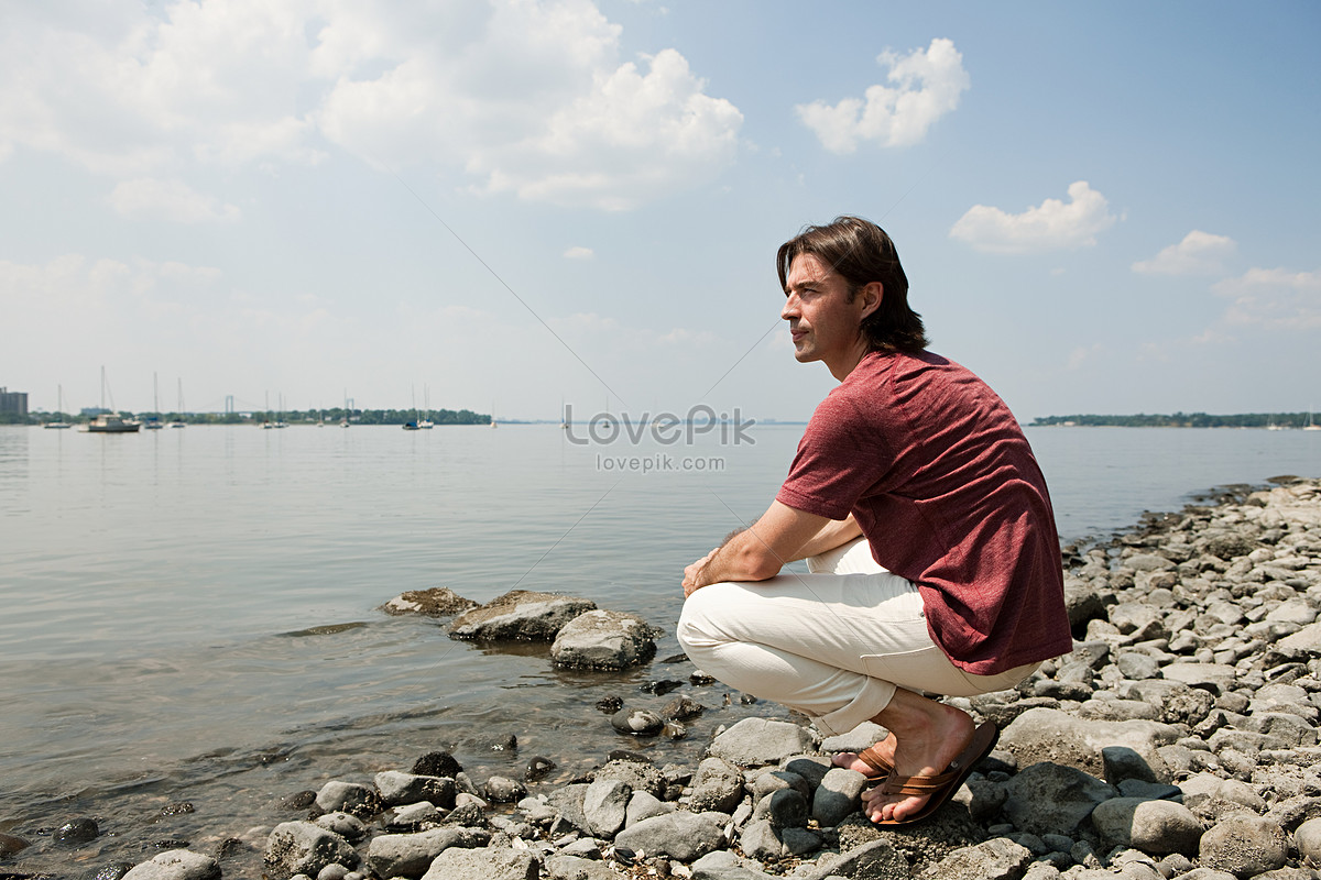 Man In Acrobatic Pose On Beach High-Res Stock Photo - Getty Images