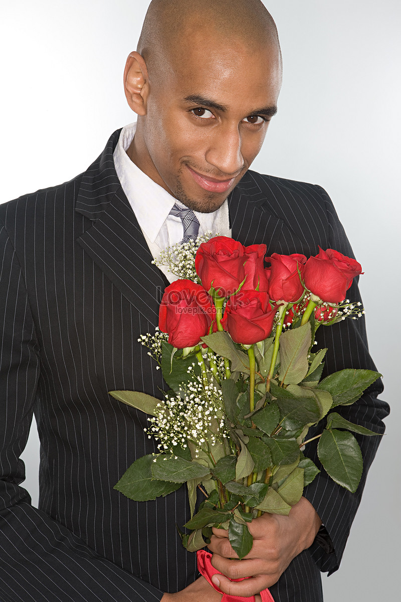 Smiling Man Holding A Bouquet Of Roses Picture And HD Photos | Free