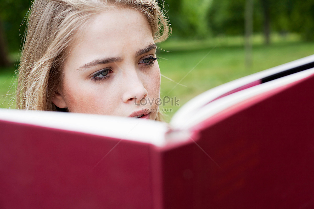 teen girl reading a book