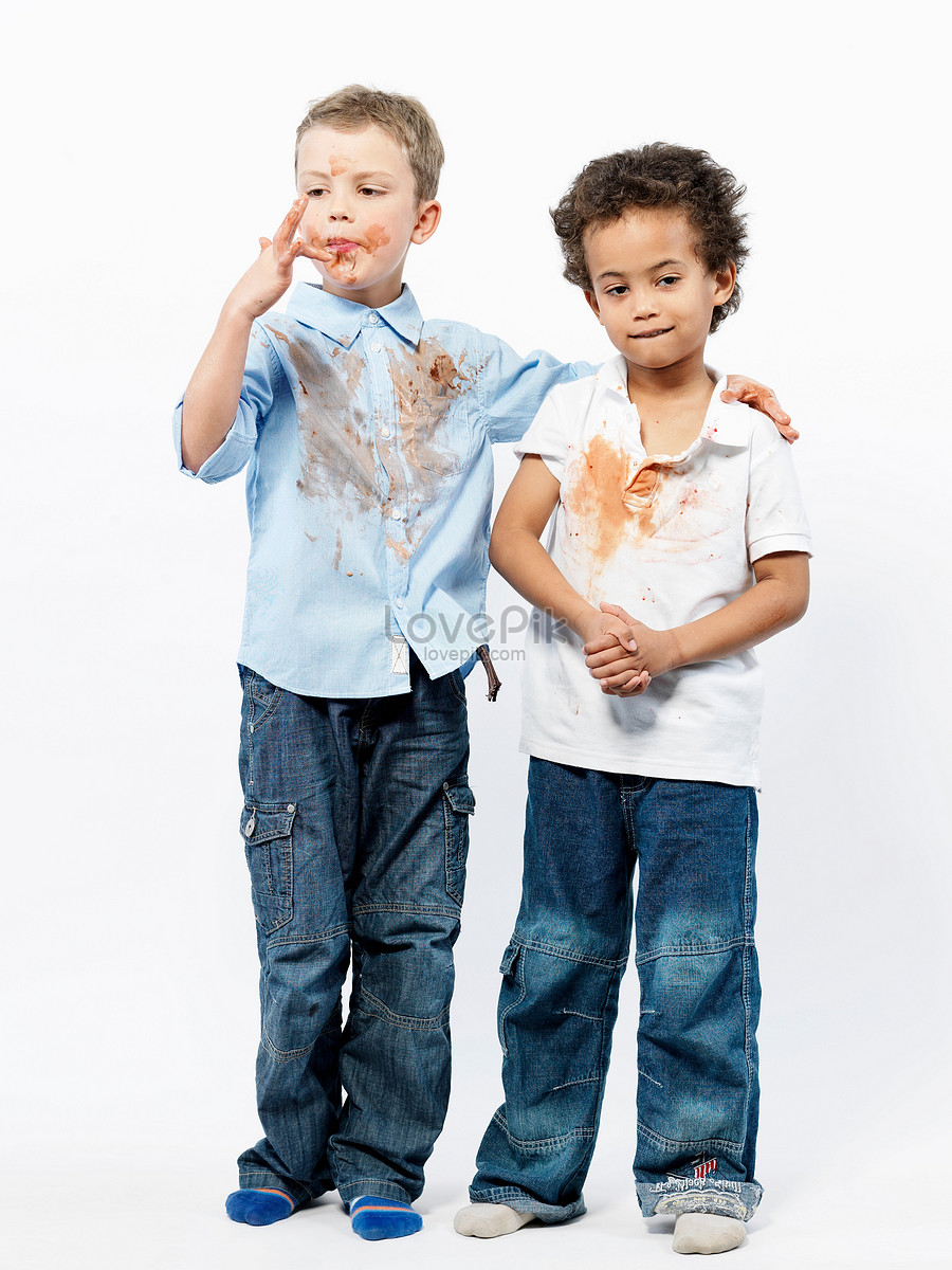 Premium Photo | The boy poses in a school uniform on a white background the  model is wearing a blue shirt and a gray jacket vertycal photo