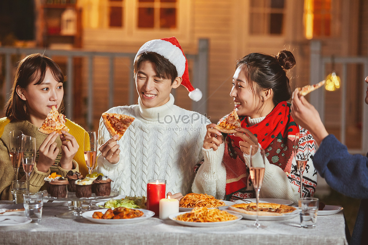 Young People Eating Pizza Together On Christmas Eve Picture And HD ...