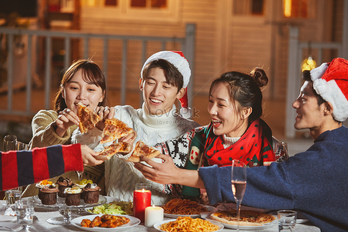 Young People Eating Pizza Together On Christmas Eve Picture And HD ...