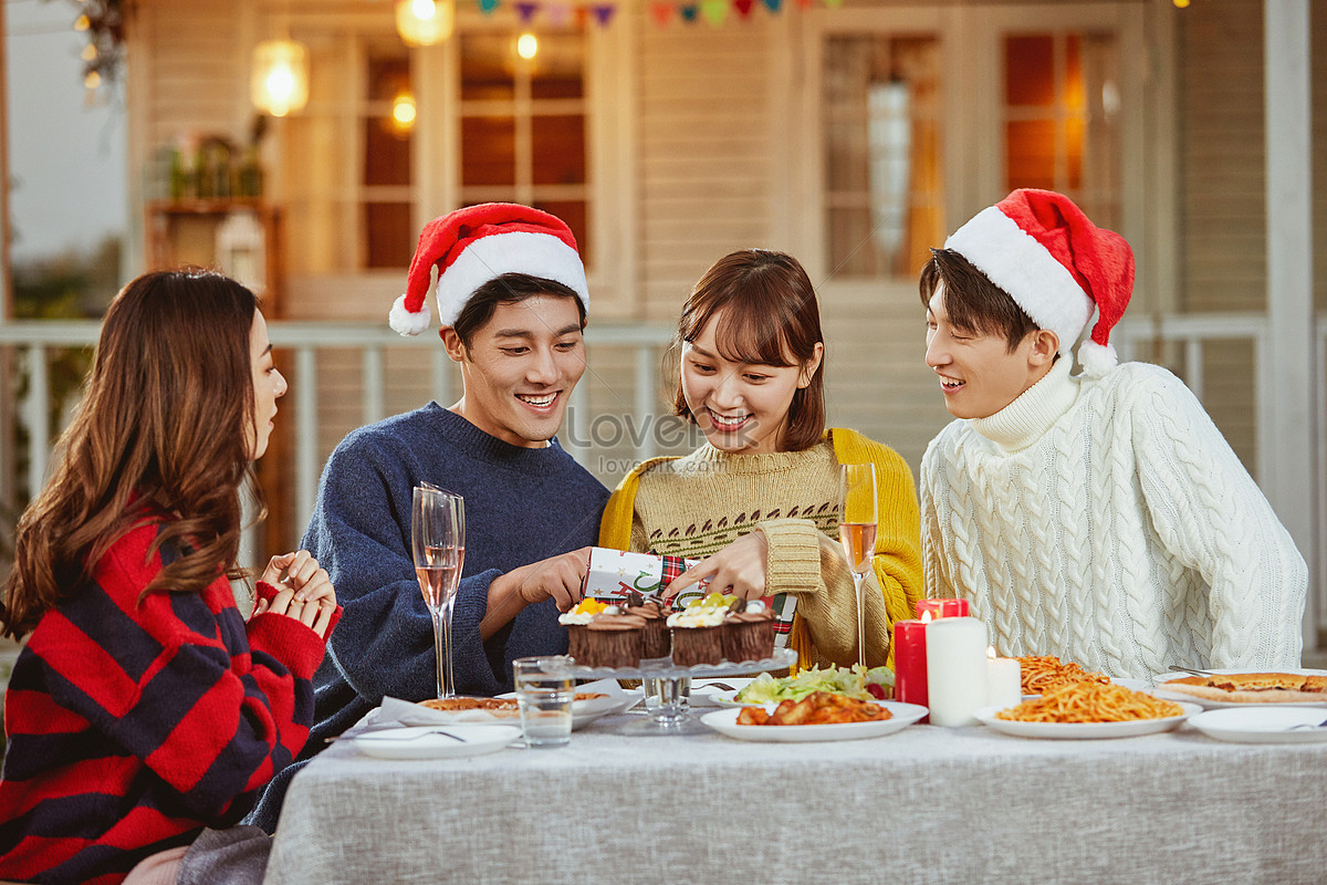 Young People Give Each Other Gifts At Christmas Picture And HD Photos ...