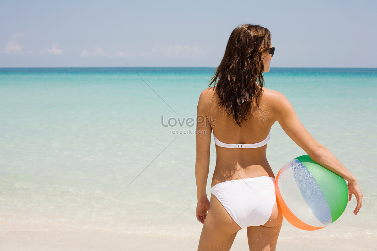 Young Woman Holding A Beach Ball Picture And HD Photos