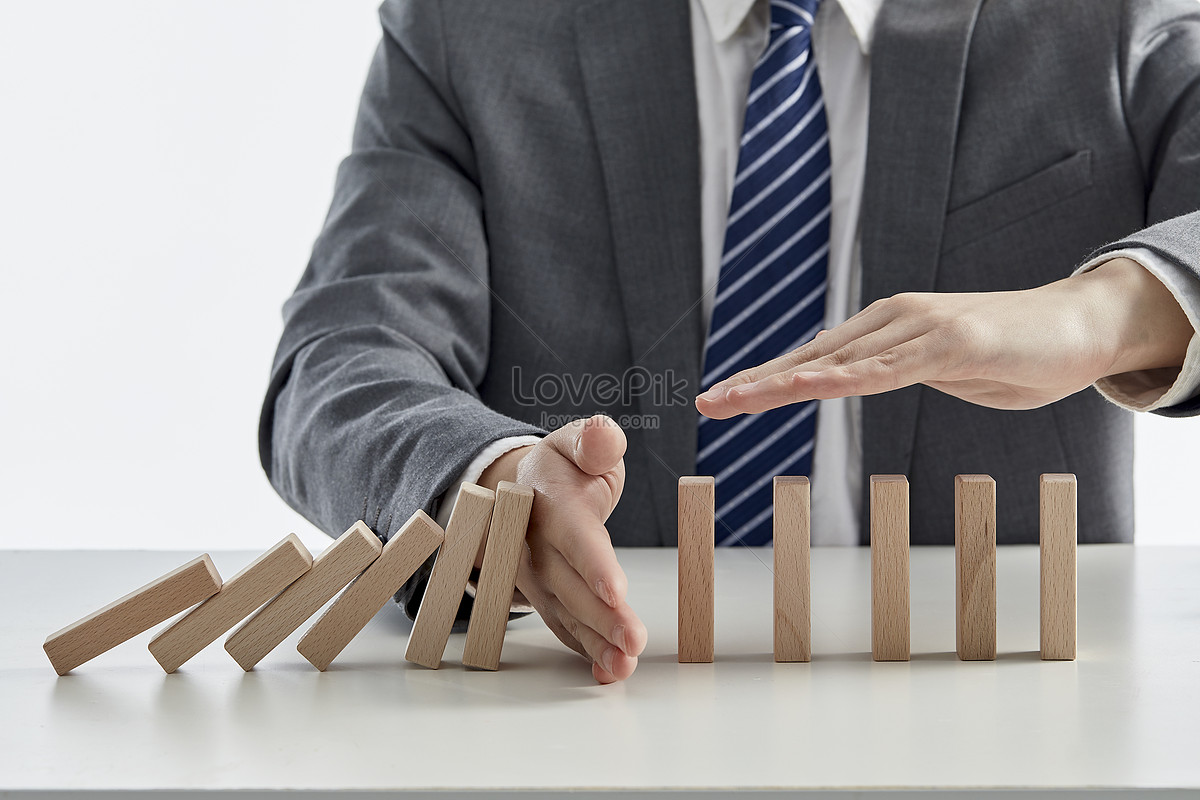 Business Men Blocking Collapsed Blocks With Hands Picture And HD Photos ...