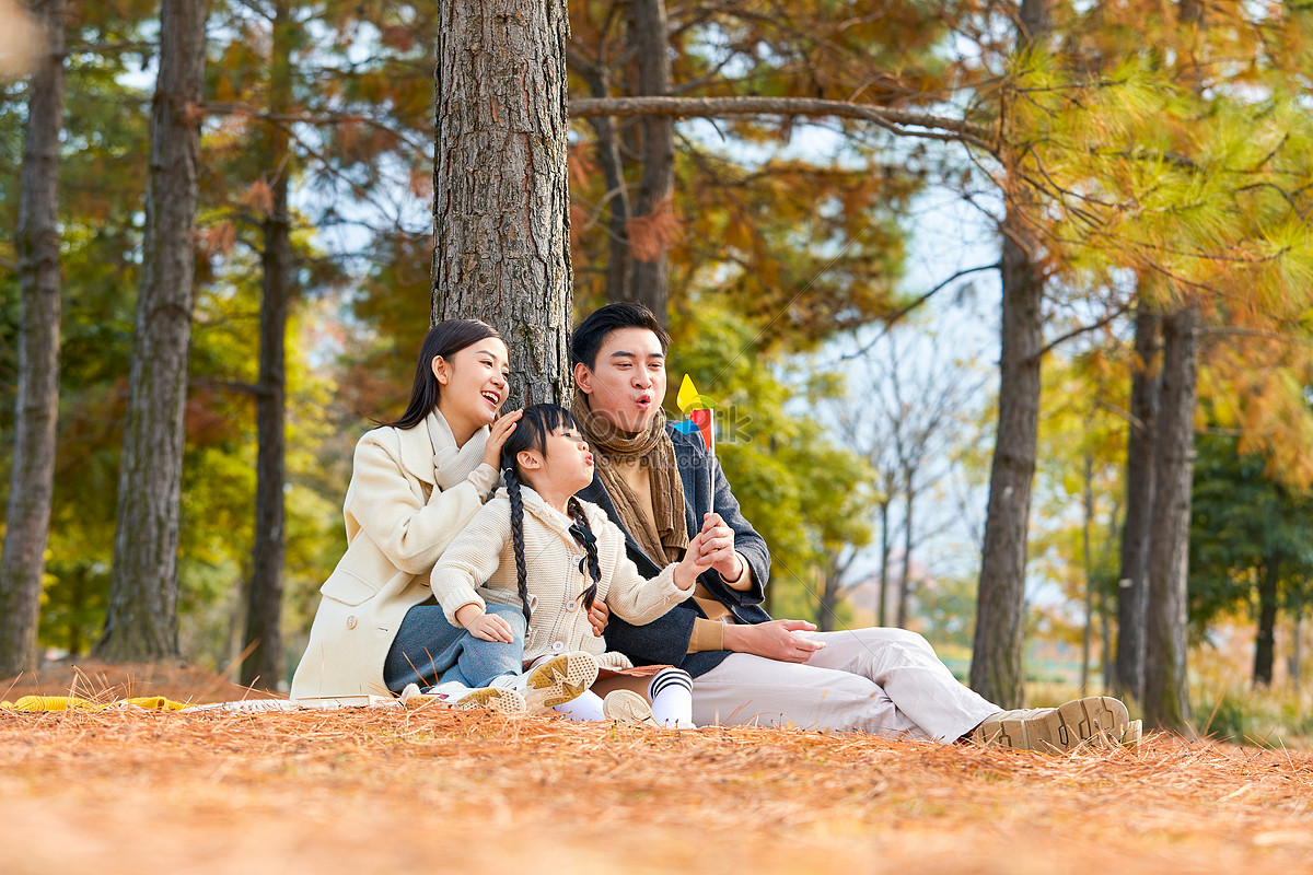 Family Of Three Playing Small Windmill Together Picture And HD Photos ...