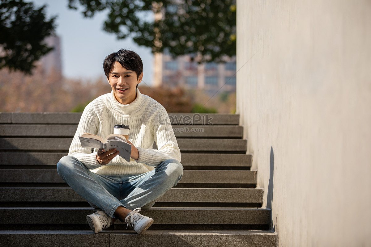 Young Male Sitting On Stairs Reading Picture And HD Photos | Free Download  On Lovepik