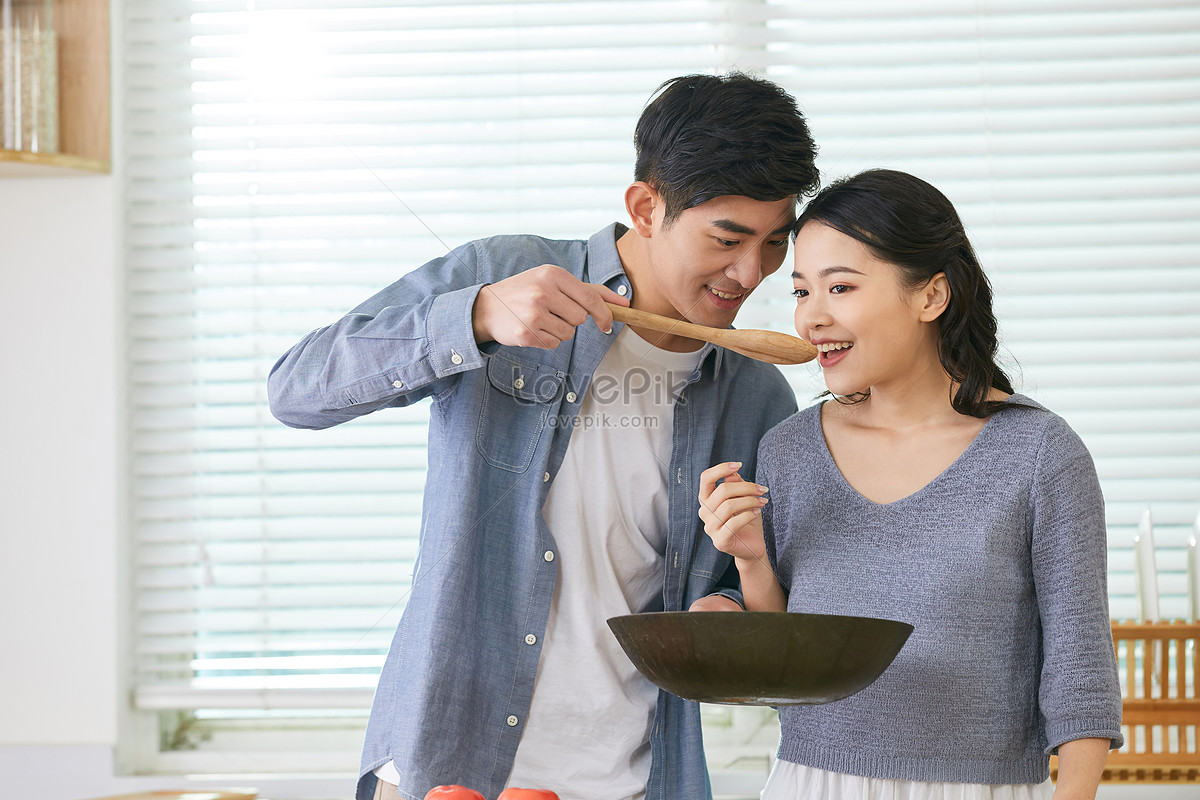 Young Wife Smelling Her Husband Cooking Picture And HD Photos | Free ...