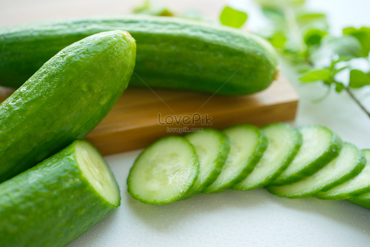 Fresh Green Cut Baby Cucumbers Stock Photo - Download Image Now