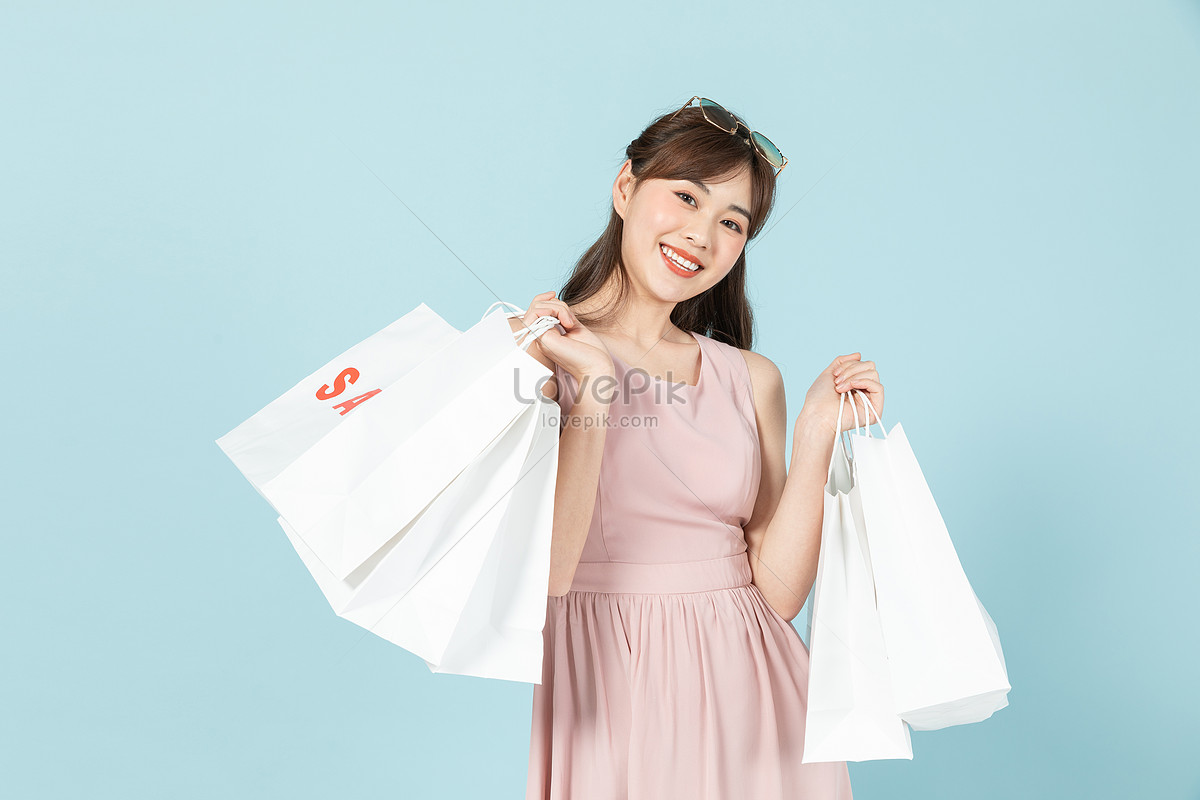 Fashionable Women Carrying Promotional Shopping Bags Picture And HD ...