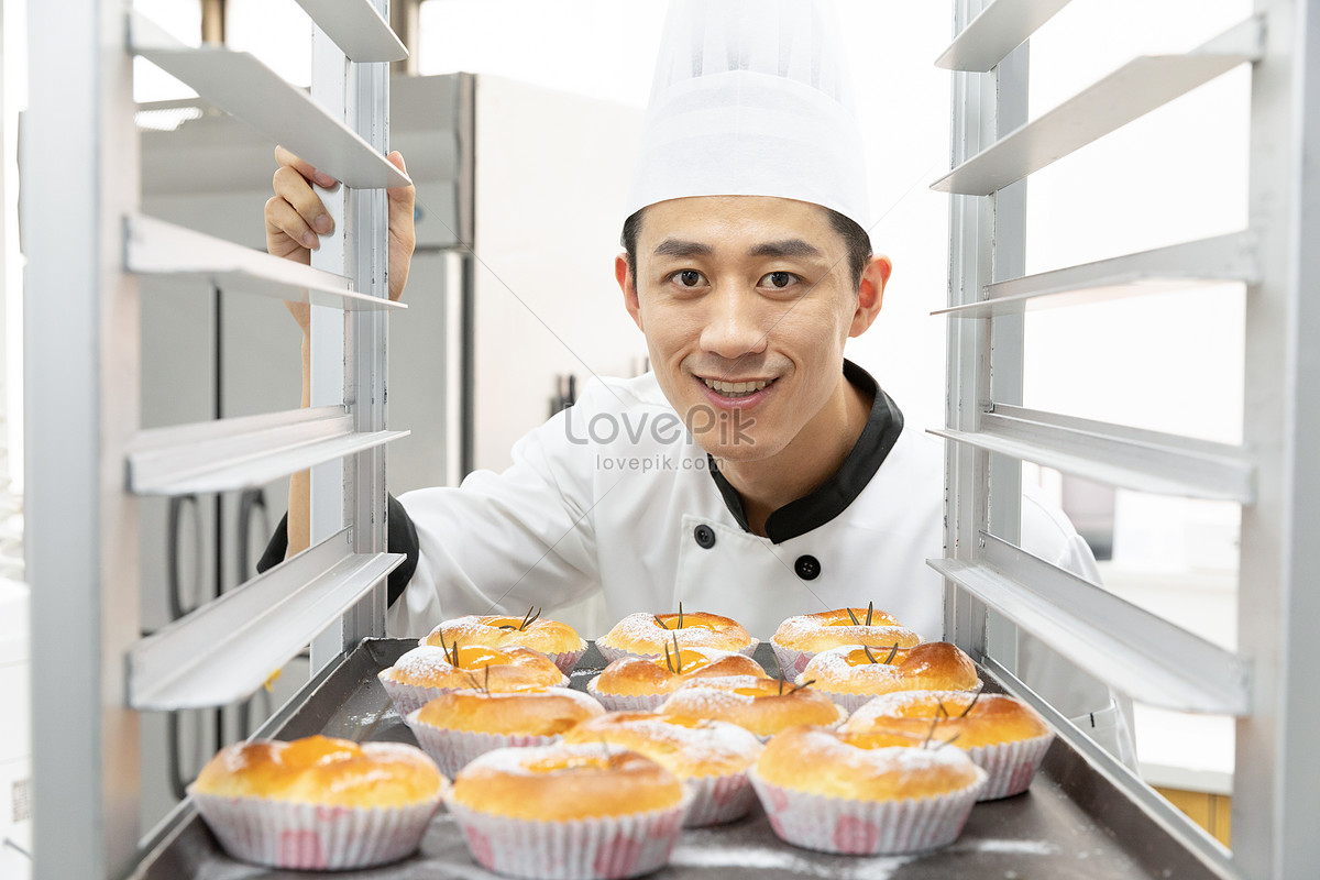 Male Baker Baking Fresh Bread In The Bakehouse Stock Photo, Picture and  Royalty Free Image. Image 12443418.