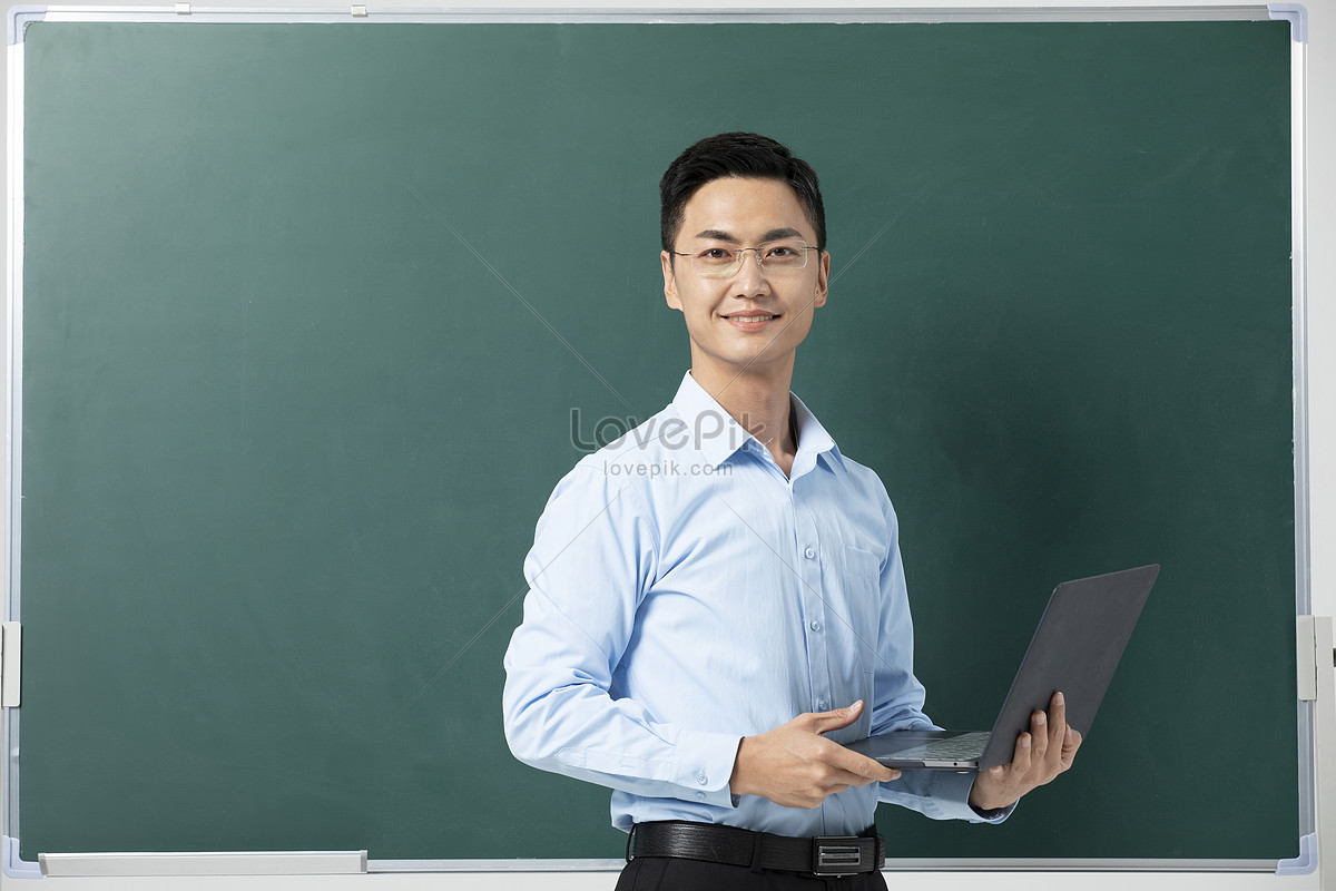 Male Teacher Giving Lecture In Front Of Blackboard Picture And HD ...