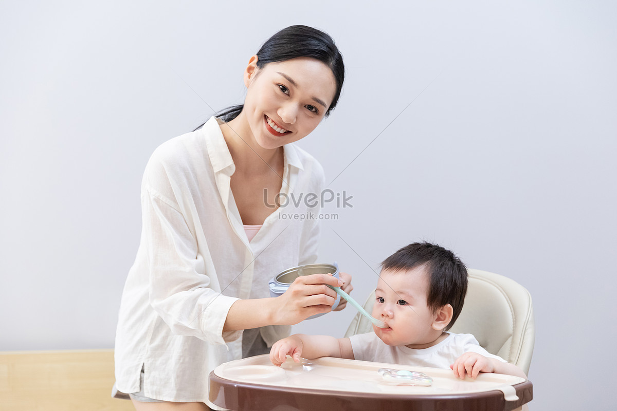 Mother Feeds Baby Food Picture And HD Photos