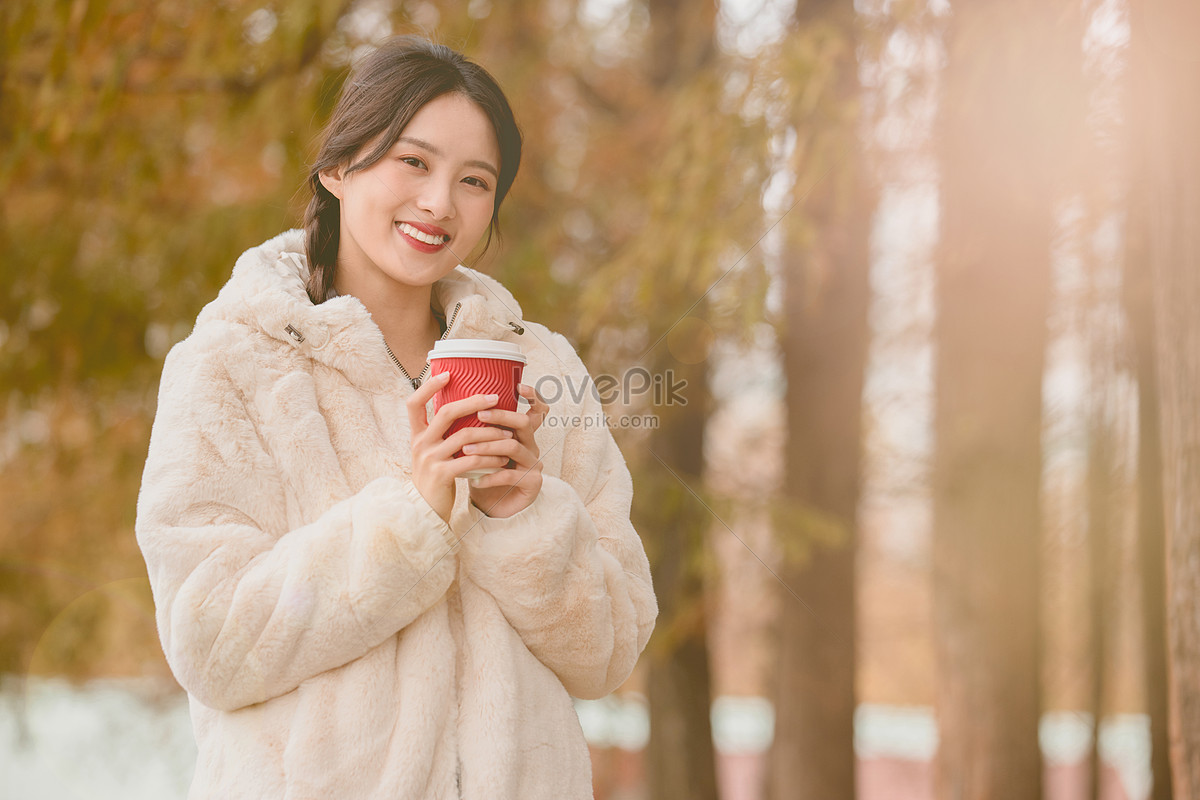 Beautiful Woman Holding Coffee In Autumn And Winter Outdoors Picture And HD  Photos | Free Download On Lovepik