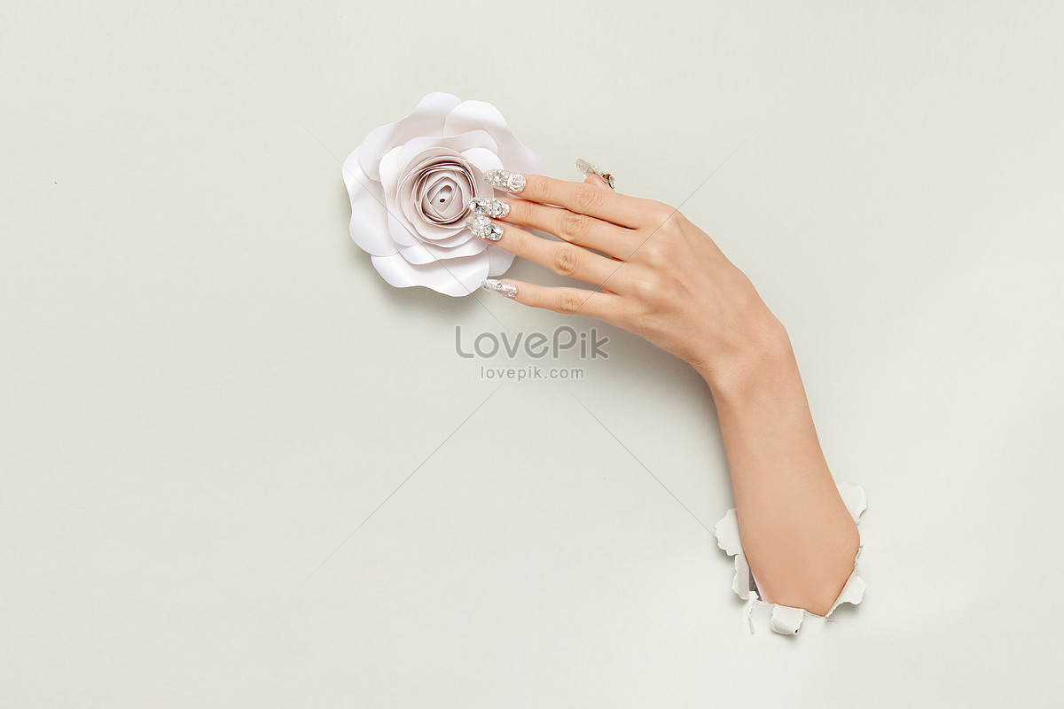 lovepik-close-up-of-female-hand-with-manicure-touching-picture_501711938.jpg