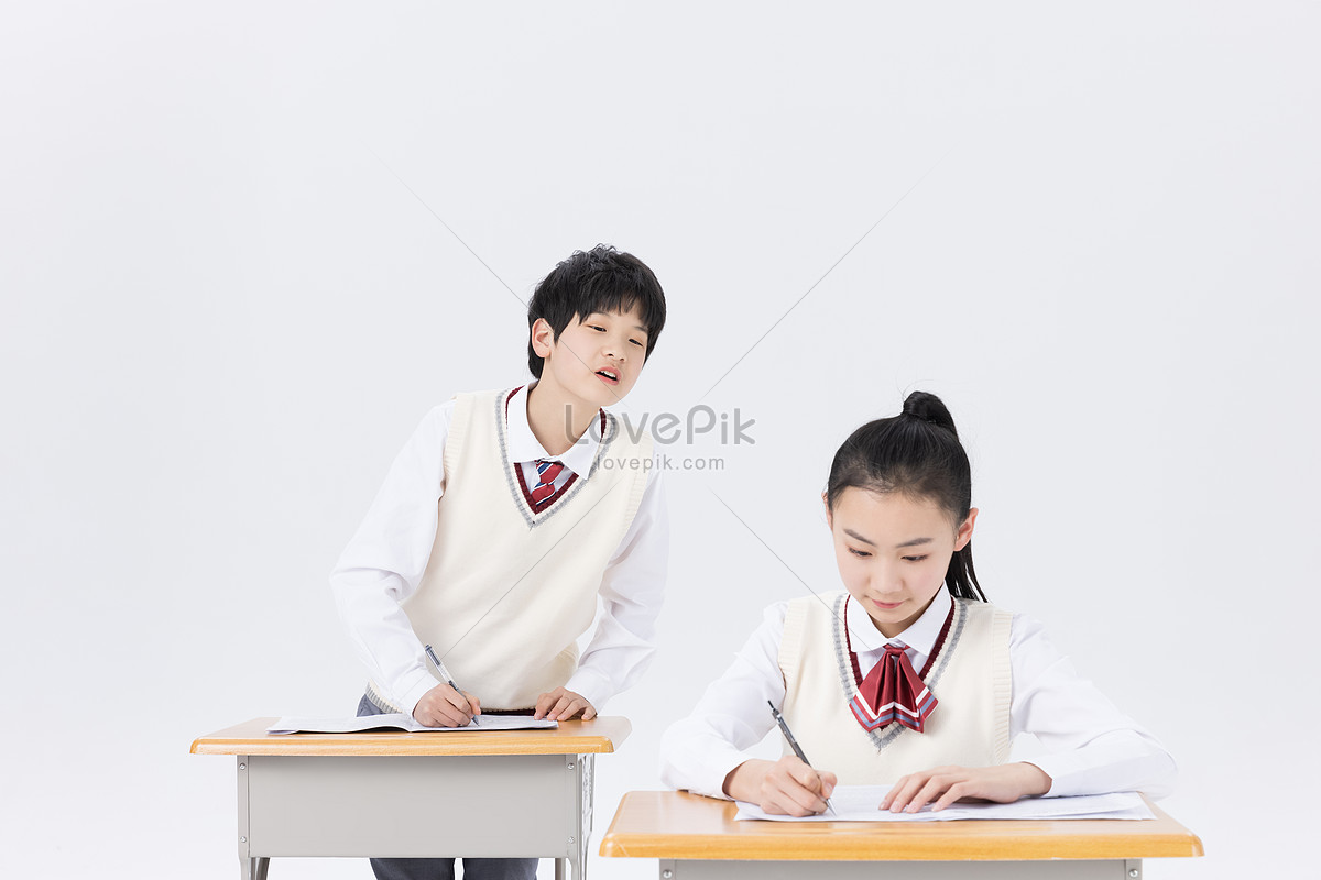 Junior high school students who secretly copy homework in self-study class Photo