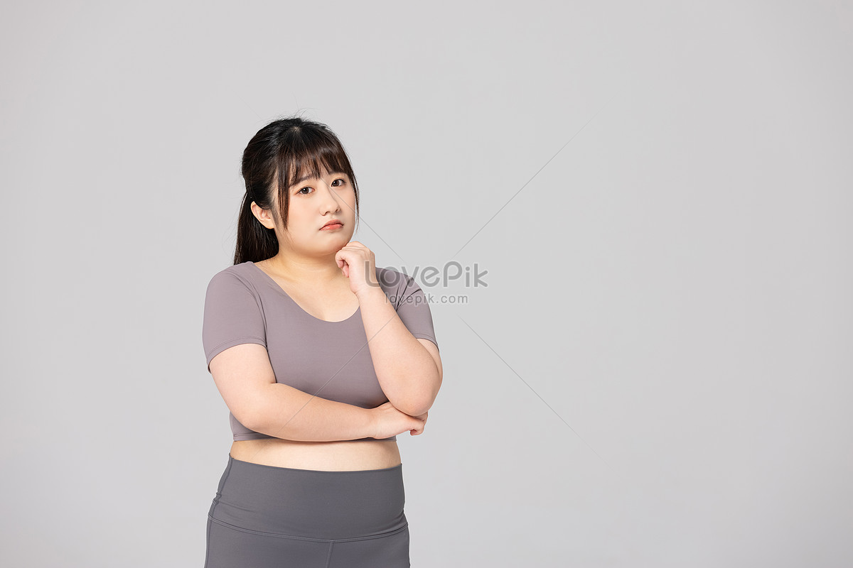 Asian woman show fat belly big size overweight and obesity at