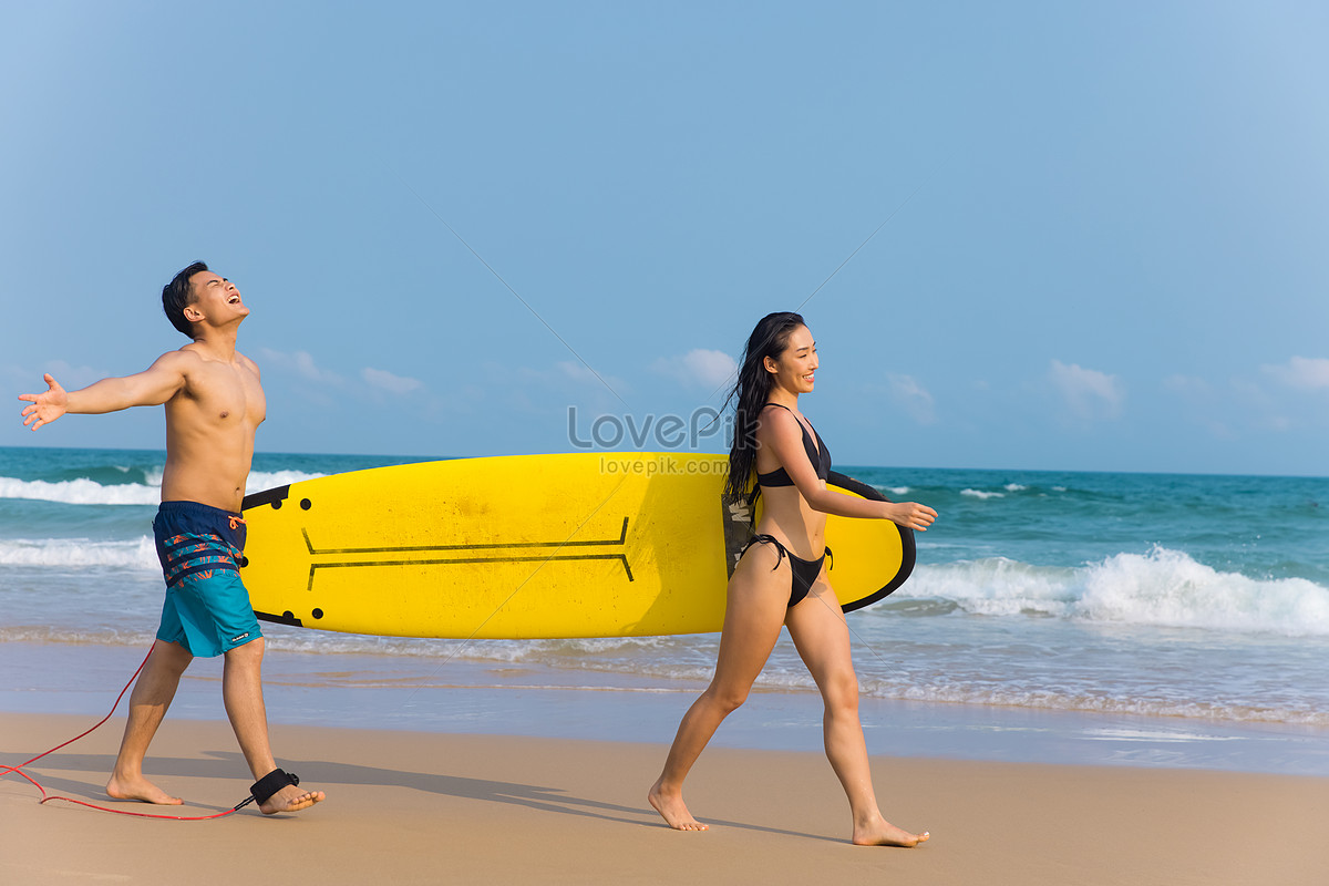 Youth Couple Walking On The Beach Of Surfboard Picture And Hd Photos