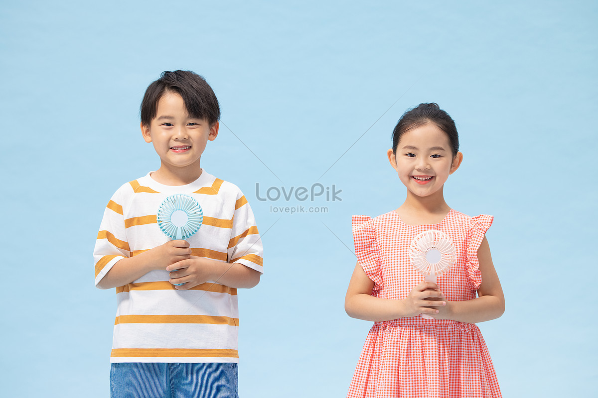 Children Holding A Small Fan Picture And Hd Photos 